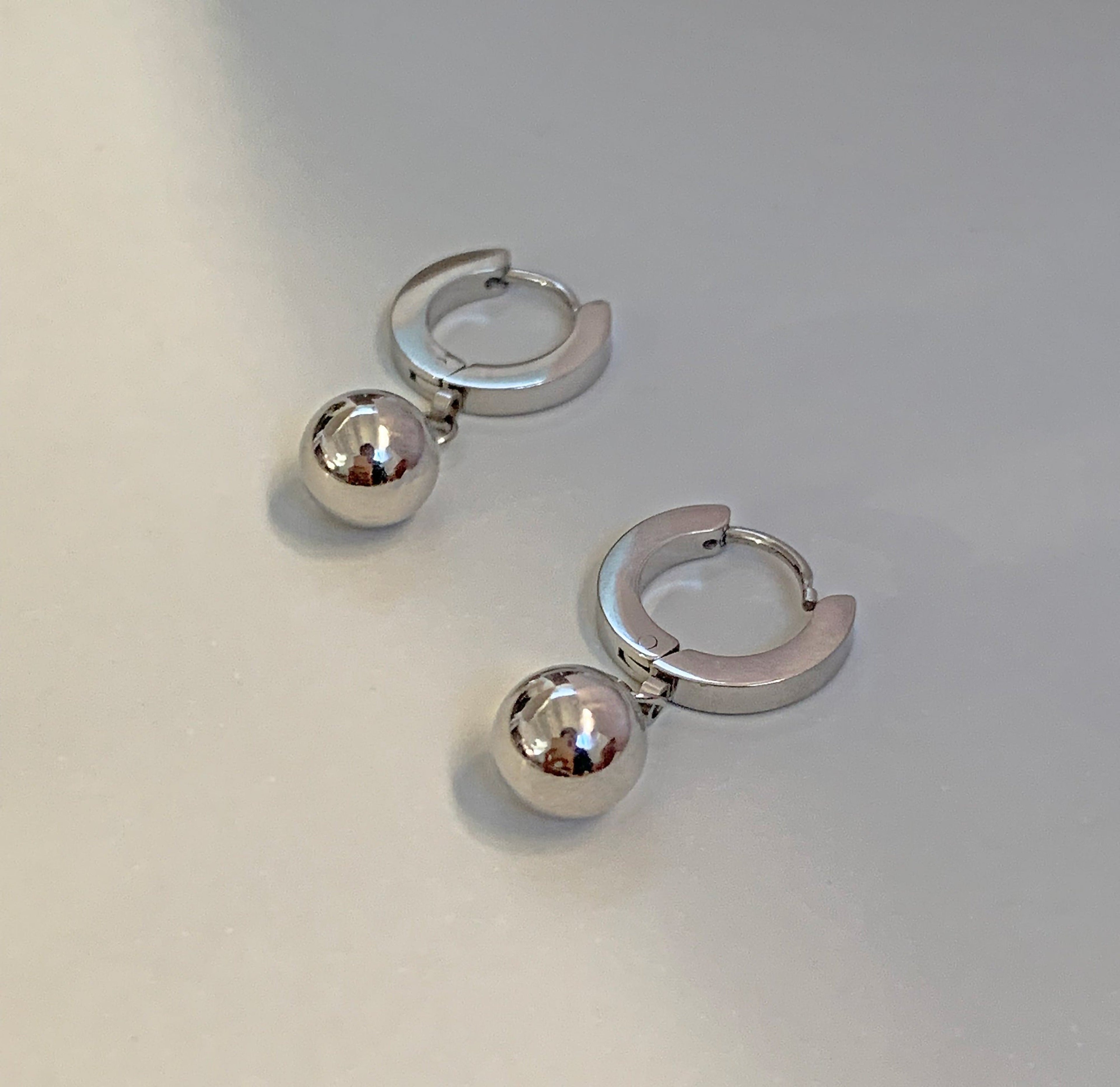 ELLIE SILVER BALL DROP HUGGIE EARRINGS